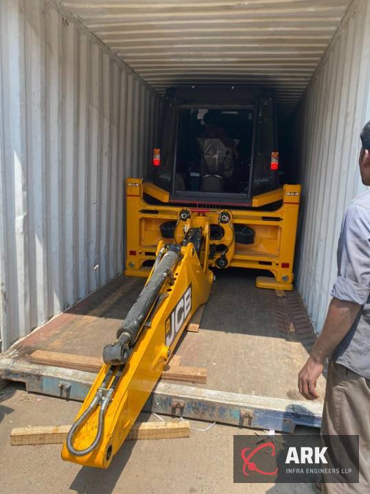 Backhoe loaded into a container
