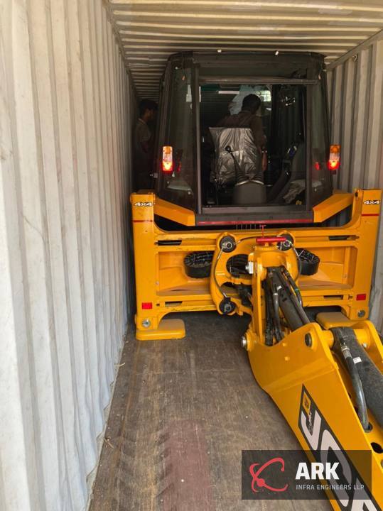 Backhoe loaded into a container