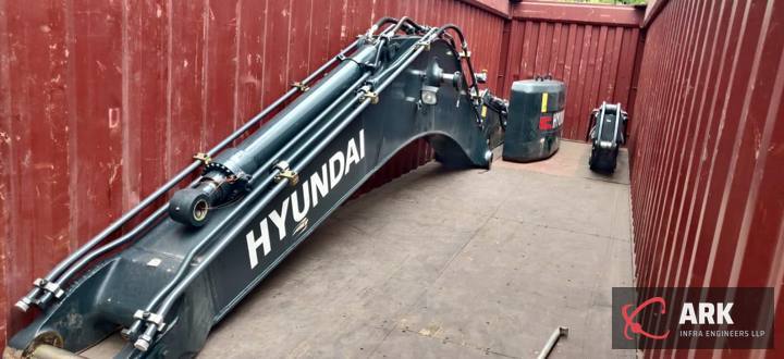 Excavator boom packed in a container