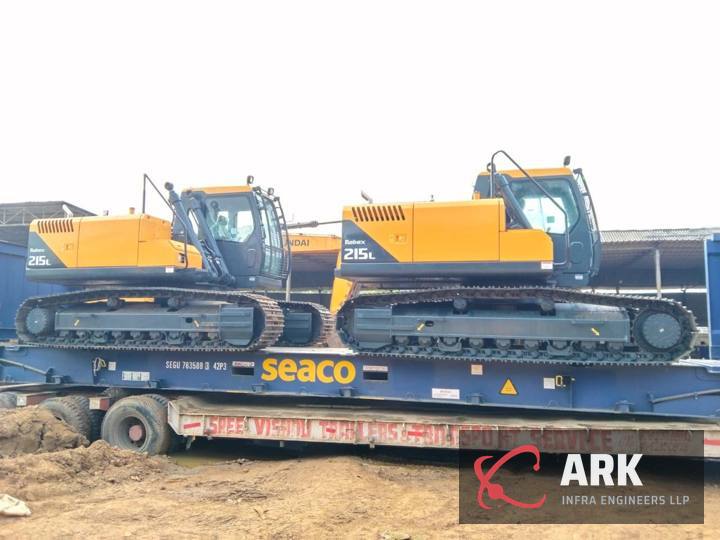 Excavators on a flat rack