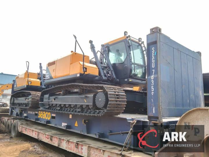 Excavators on a flat rack