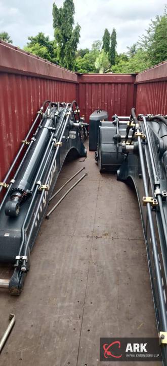 Long reach booms packed in a container