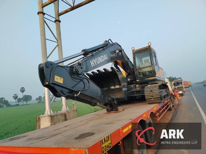 Excavator on the road to site